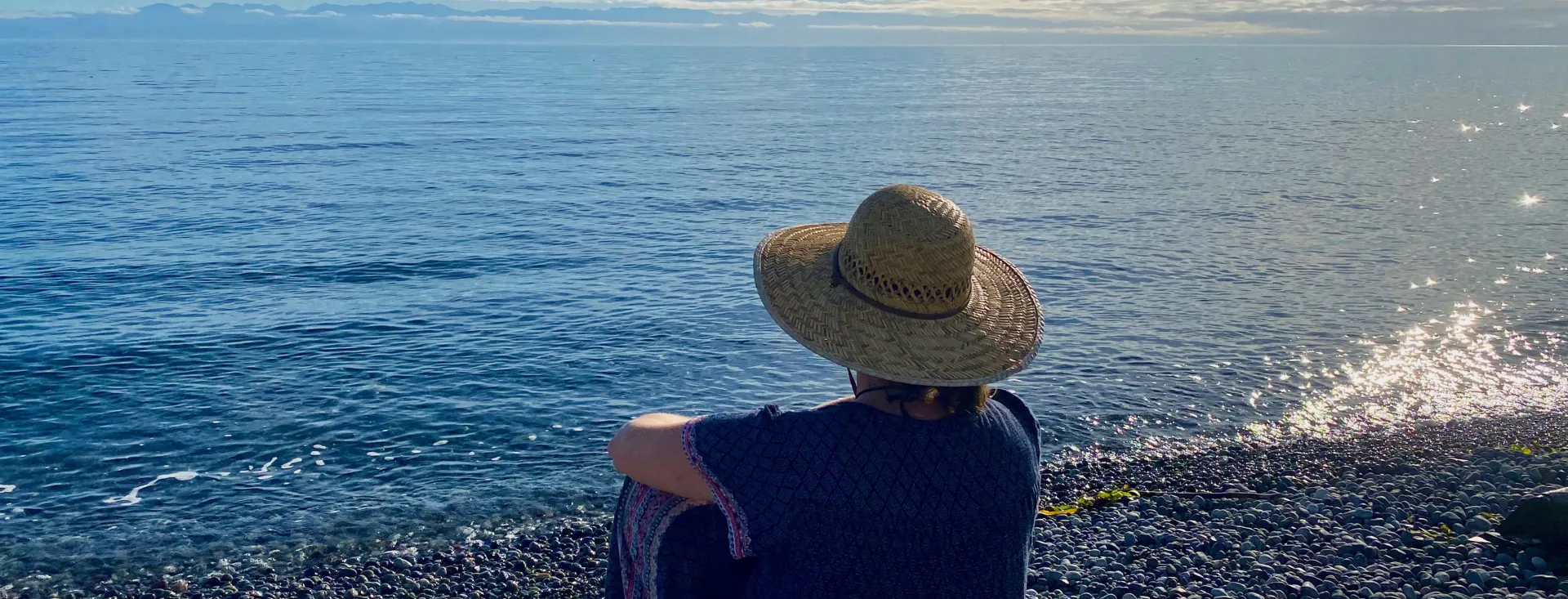 Woman on beach with hat