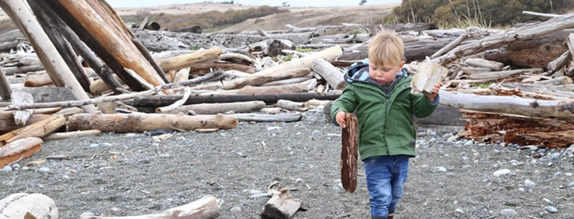 Boy walking on South Beach San Juan Island Washington
