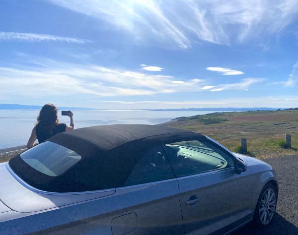 Woman taking scenic photo on San Juan Island, Washington