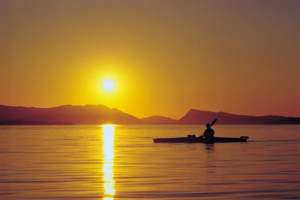 Kayaker at Sunset on San Juan Island - photo by Mark Gardner