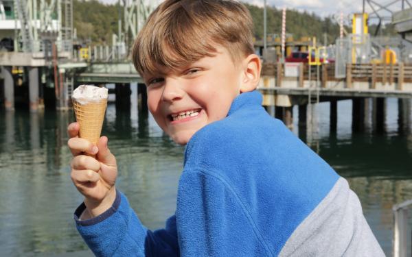 Boy Eating Ice Cream by Ferry - Lisette Wolter-McKinley