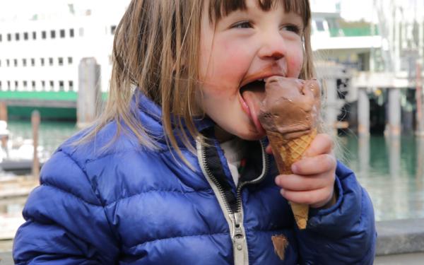 Girl eating Ice Cream in Friday Harbor with Ferry - Lisette Wolter-McKinley