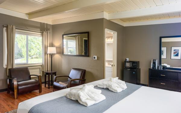 Earthbox Inn - San Juan Island Washington - Sky Place Cabana king bed 2 chairs view into bathroom