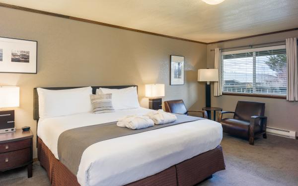 Earthbox Inn - San Juan Island Washington - Sky Place upstairs king bed chairs and window