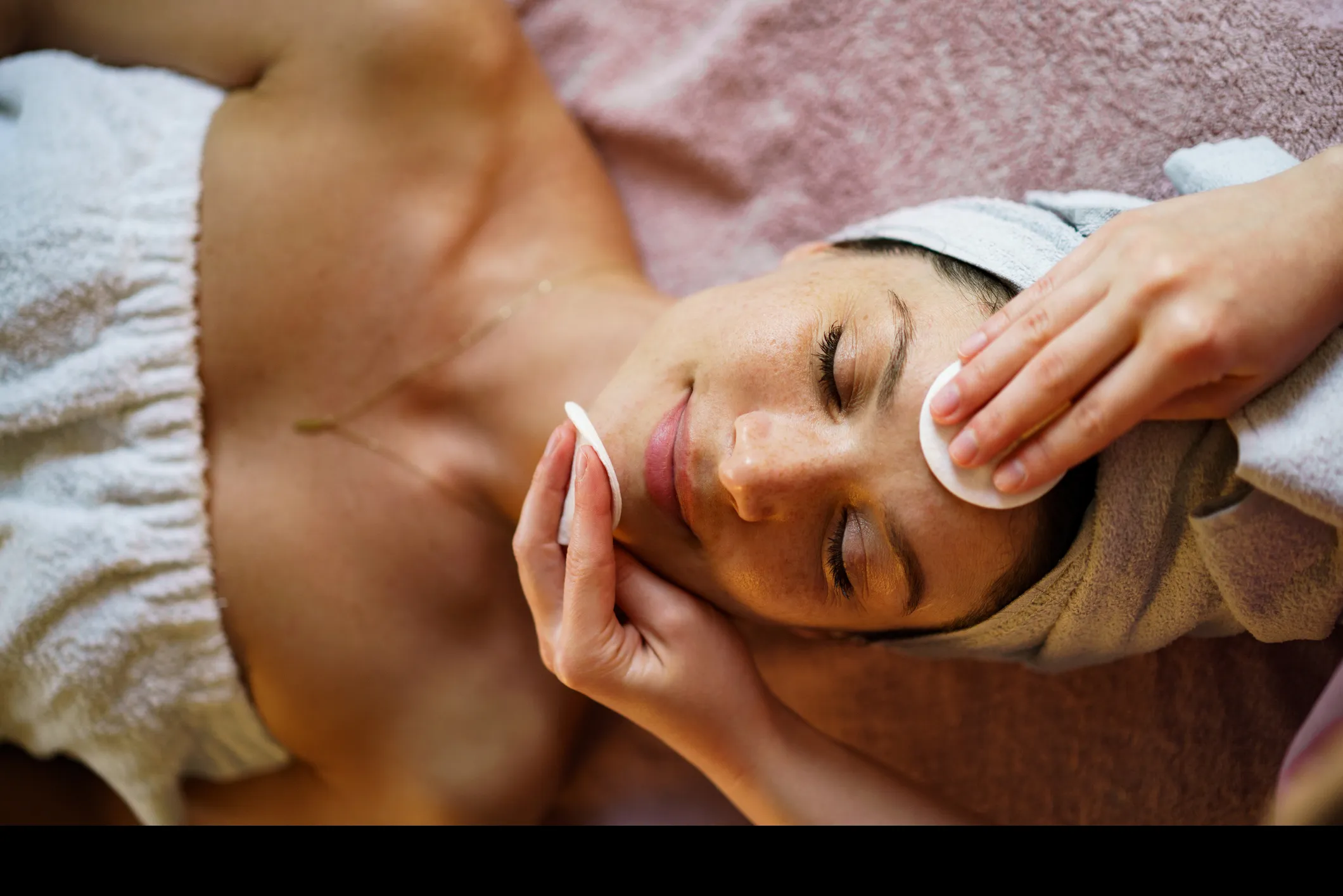 Woman receiving a facial