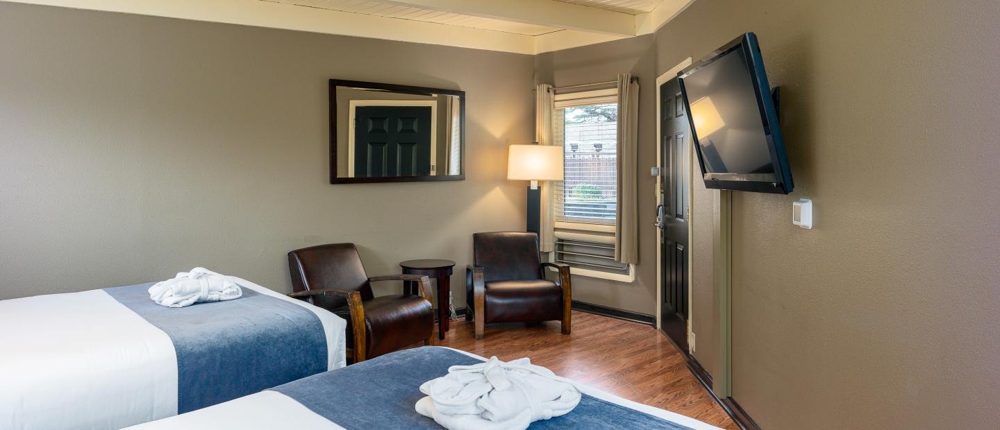 Earthbox Inn - San Juan Island Washington - Earth Place Cabana view from bed of 2 chairs and window