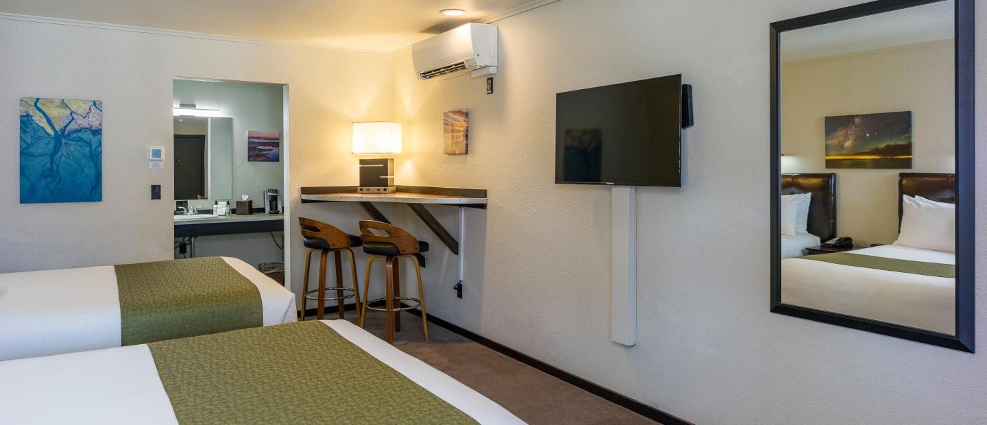 Earthbox Inn - San Juan Island Washington - Earth Place Upstairs side view of 2 queen beds tv and counter