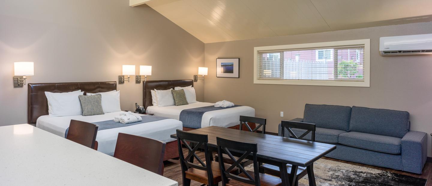 Earthbox Inn - San Juan Island Washington - Sea Place table beds couch from door